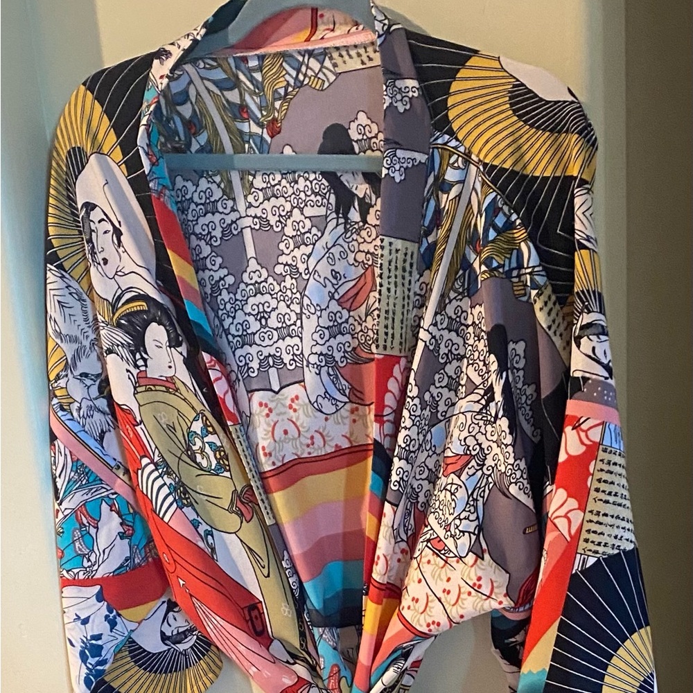 Kimono / robe satin type fabric. Use as cover up or robe. No branding.